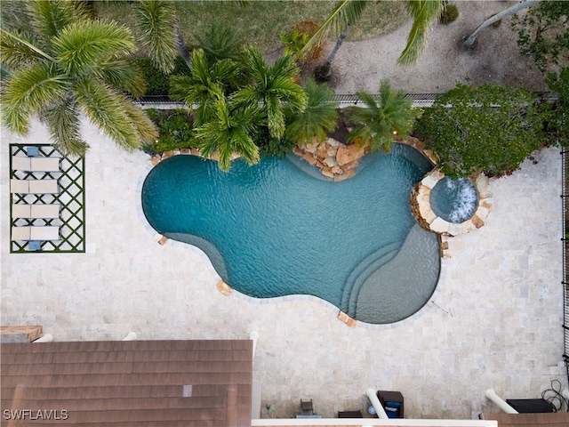 view of pool featuring a pool with connected hot tub
