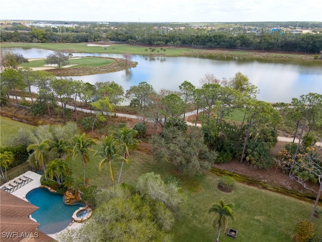 drone / aerial view of a nearby body of water and a pool area