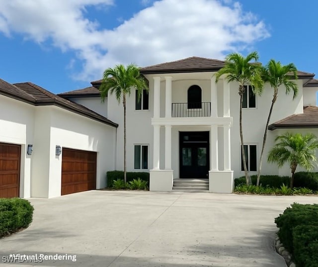 mediterranean / spanish-style house with french doors, a garage, stucco siding, driveway, and a tile roof