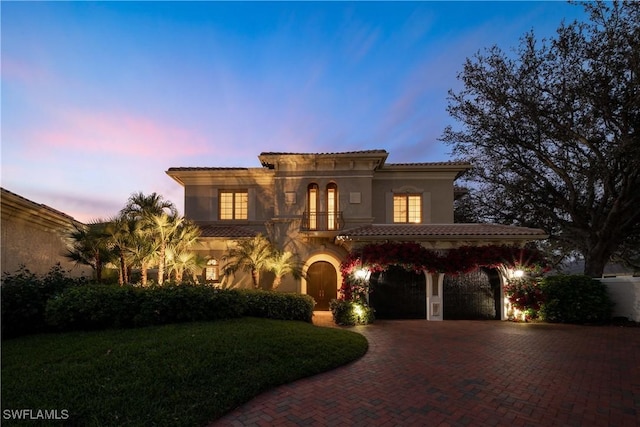 mediterranean / spanish-style home with a carport