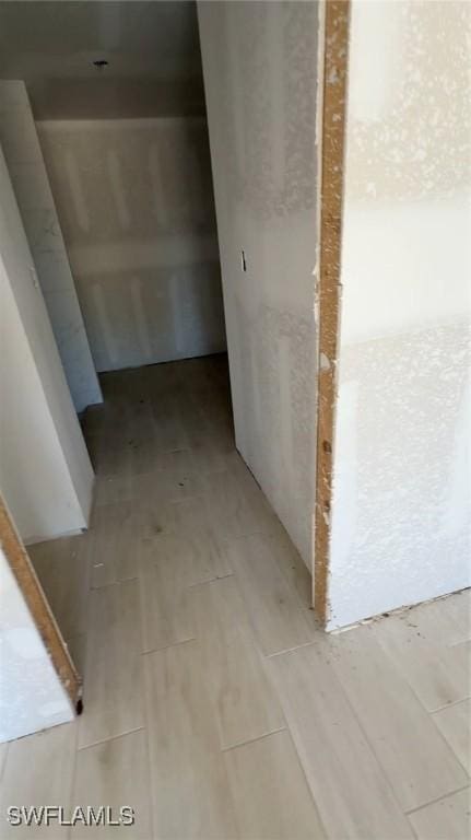 hallway with wood finish floors