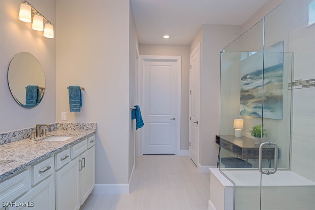 6217 Harmony Dr, Ave Maria, FL 34142 - full bathroom featuring baseboards, a shower stall, vanity, and recessed lighting