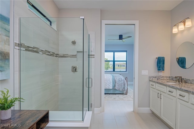 6217 Harmony Dr, Ave Maria, FL 34142 - full bathroom with ensuite bathroom, ceiling fan, a shower stall, vanity, and baseboards