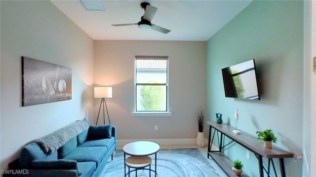 6217 Harmony Dr, Ave Maria, FL 34142 - living room with visible vents, baseboards, and ceiling fan