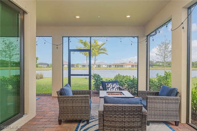 6217 Harmony Dr, Ave Maria, FL 34142 - sunroom / solarium with a water view, outdoor lounge area, and a healthy amount of sunlight