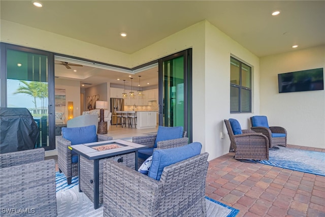 6217 Harmony Dr, Ave Maria, FL 34142 - view of patio / terrace with an outdoor fire pit