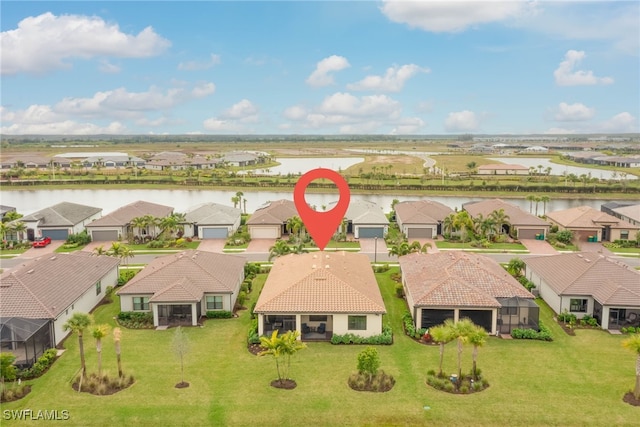 6217 Harmony Dr, Ave Maria, FL 34142 - birds eye view of property featuring a residential view and a water view