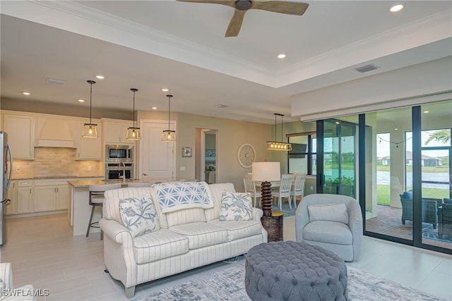 6217 Harmony Dr, Ave Maria, FL 34142 - living room with crown molding, visible vents, a ceiling fan, and recessed lighting
