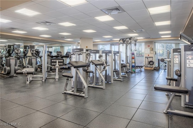 gym featuring a paneled ceiling