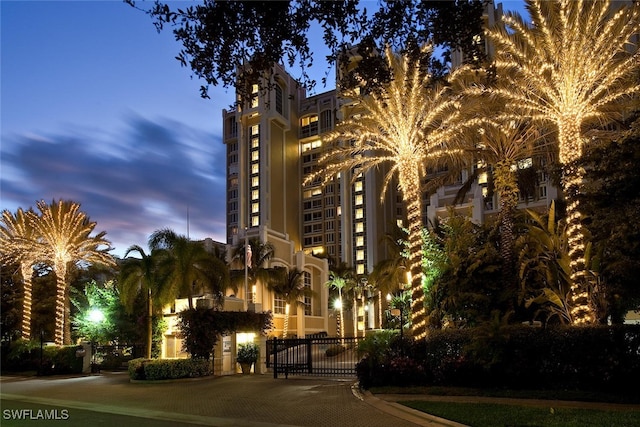 view of outdoor building at dusk