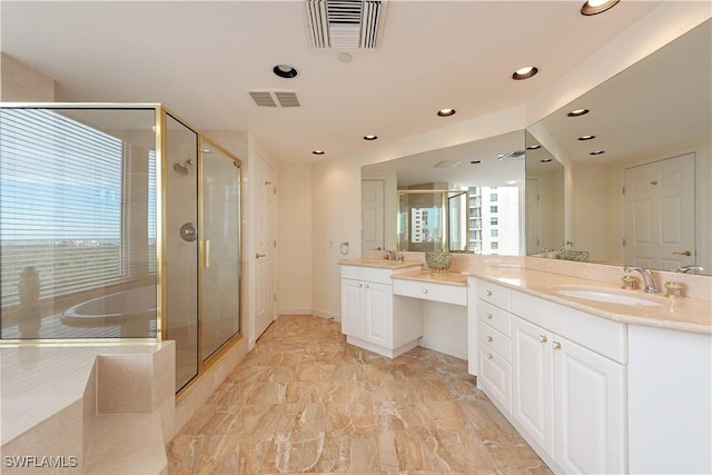 bathroom with vanity and a shower with shower door