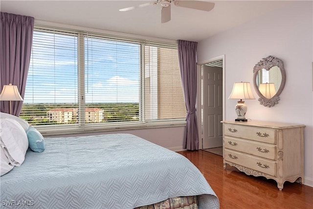 bedroom featuring hardwood / wood-style flooring and ceiling fan