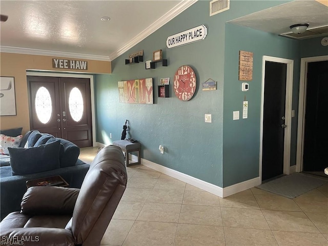 entrance foyer with crown molding, light tile patterned floors, lofted ceiling, and french doors