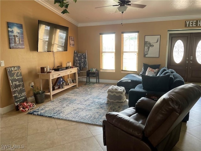 living area featuring ceiling fan, light tile patterned flooring, baseboards, french doors, and crown molding