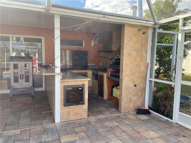 view of patio featuring an outdoor kitchen