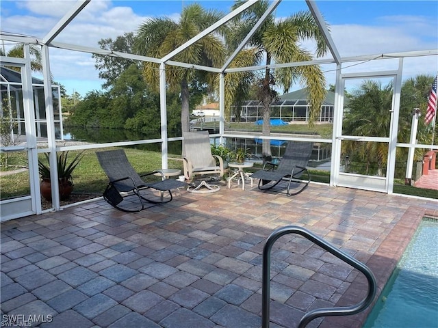 unfurnished sunroom featuring a water view