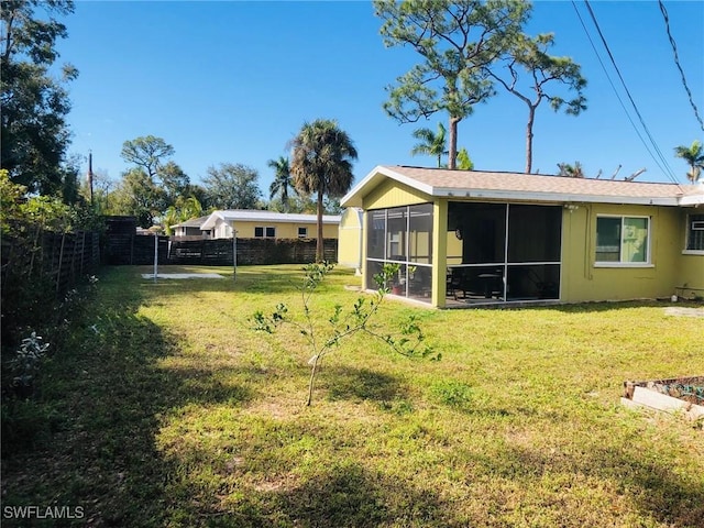 view of yard featuring a sunroom