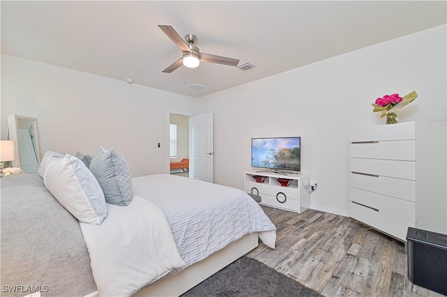 bedroom featuring hardwood / wood-style flooring and ceiling fan