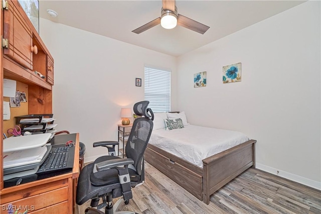 bedroom with light wood-type flooring and ceiling fan