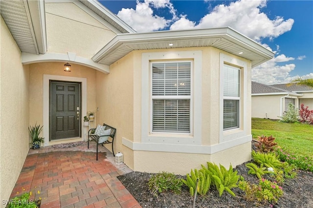 doorway to property featuring a patio