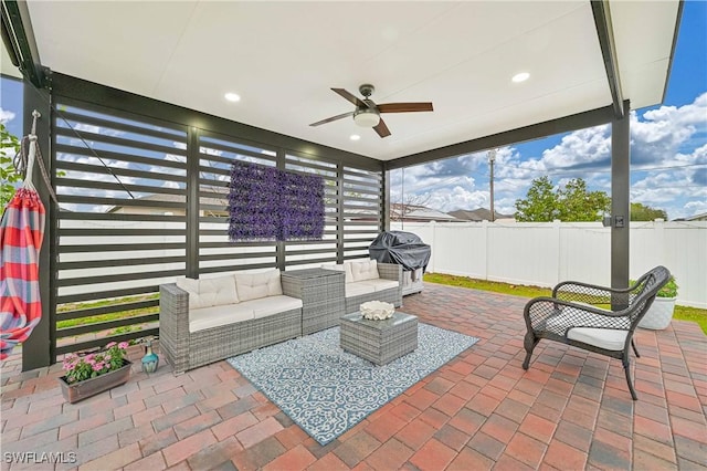 view of patio featuring grilling area, outdoor lounge area, and ceiling fan