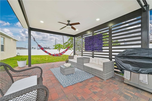 view of patio featuring an outdoor hangout area and ceiling fan