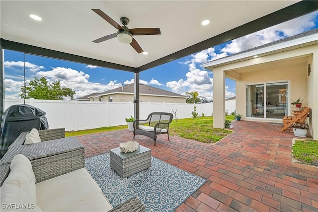 view of patio with ceiling fan and outdoor lounge area