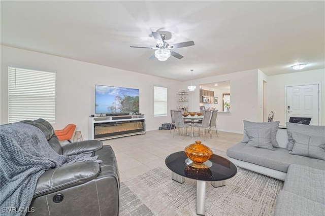 tiled living room featuring ceiling fan