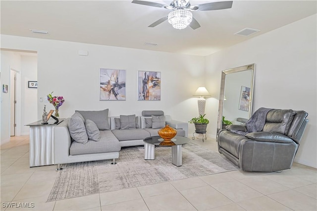 living room featuring light tile patterned floors and ceiling fan