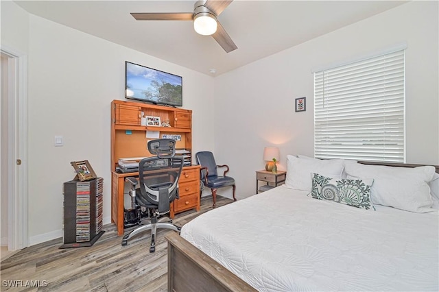 bedroom featuring hardwood / wood-style flooring and ceiling fan