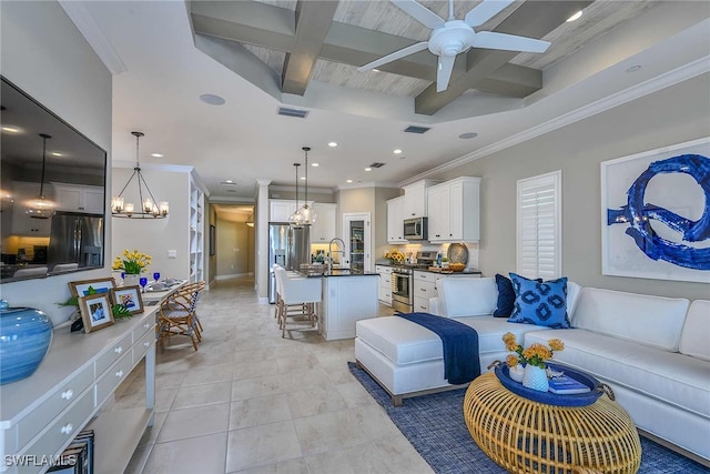 tiled living room with coffered ceiling, sink, beam ceiling, ornamental molding, and ceiling fan with notable chandelier