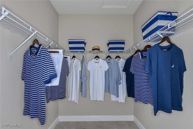 spacious closet featuring tile patterned flooring