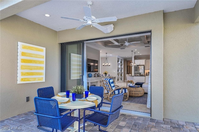 view of patio / terrace featuring ceiling fan