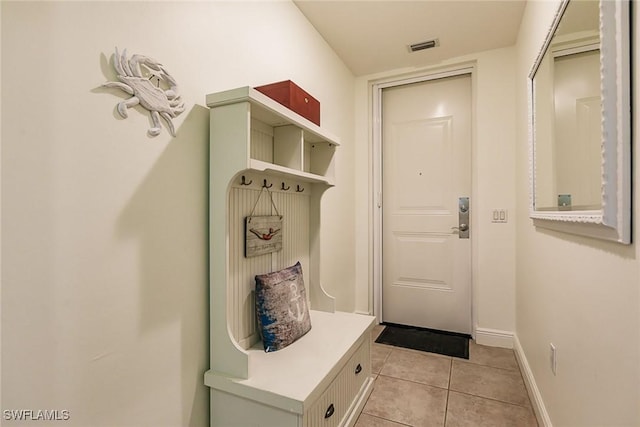 mudroom with light tile patterned flooring