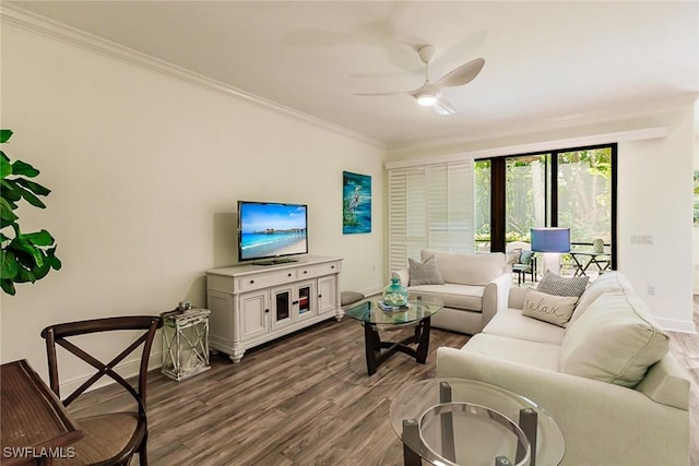 living room with ceiling fan, crown molding, and dark hardwood / wood-style floors