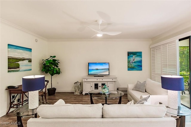 living room featuring dark wood-type flooring, ceiling fan, and ornamental molding