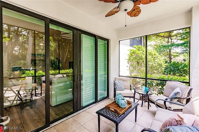 sunroom featuring ceiling fan