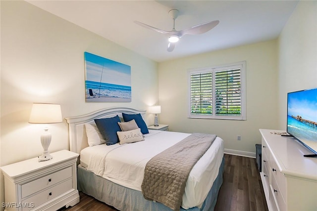 bedroom with ceiling fan and dark hardwood / wood-style flooring