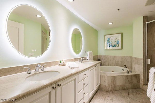 bathroom with vanity, independent shower and bath, and tile patterned flooring