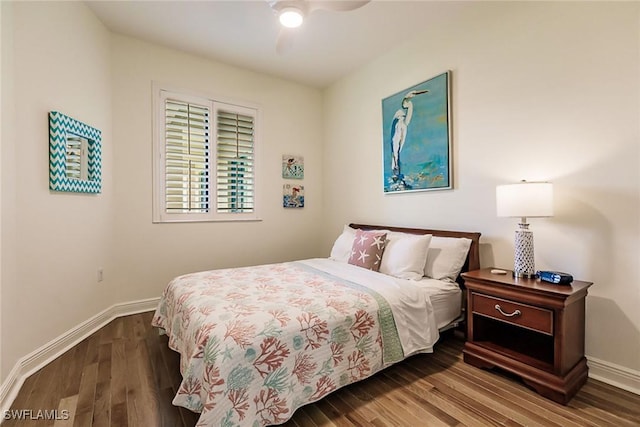 bedroom featuring wood-type flooring and ceiling fan