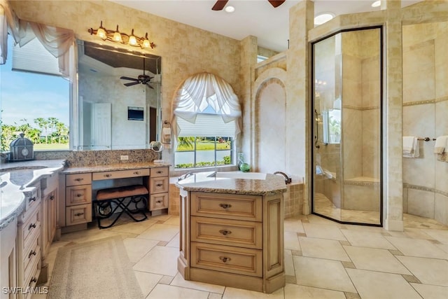 bathroom with a shower stall, a ceiling fan, and vanity