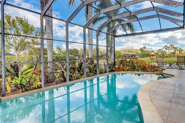 pool featuring a lanai and a patio