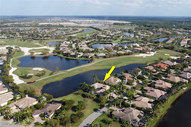 birds eye view of property with a water view, a residential view, and golf course view