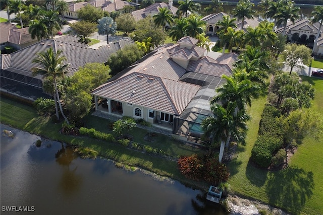 birds eye view of property with a residential view and a water view