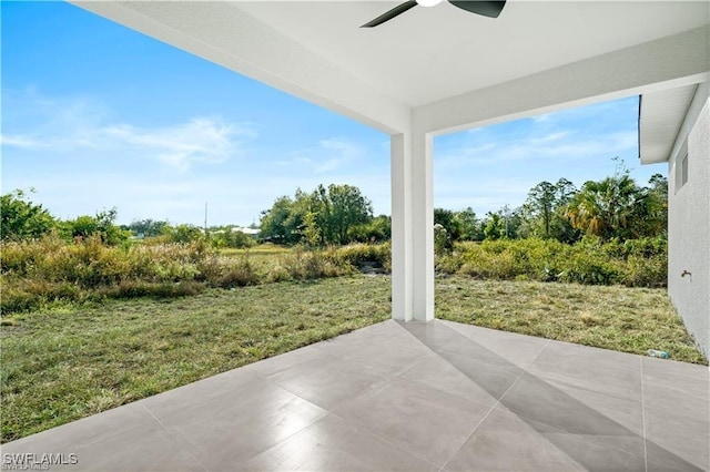 view of patio featuring ceiling fan