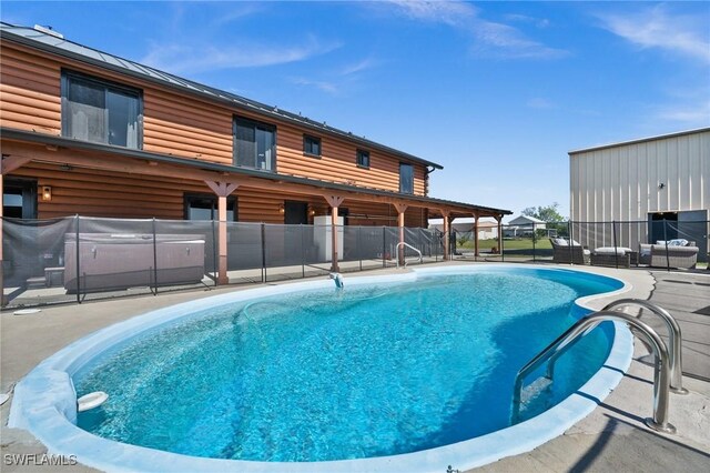 view of swimming pool featuring a patio