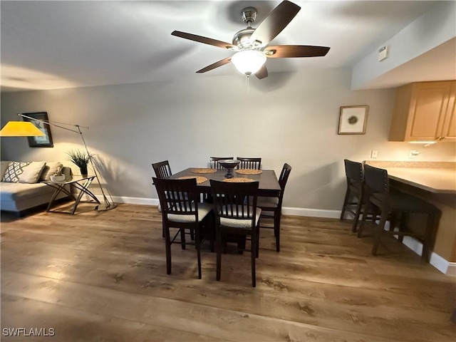 dining space with dark hardwood / wood-style floors