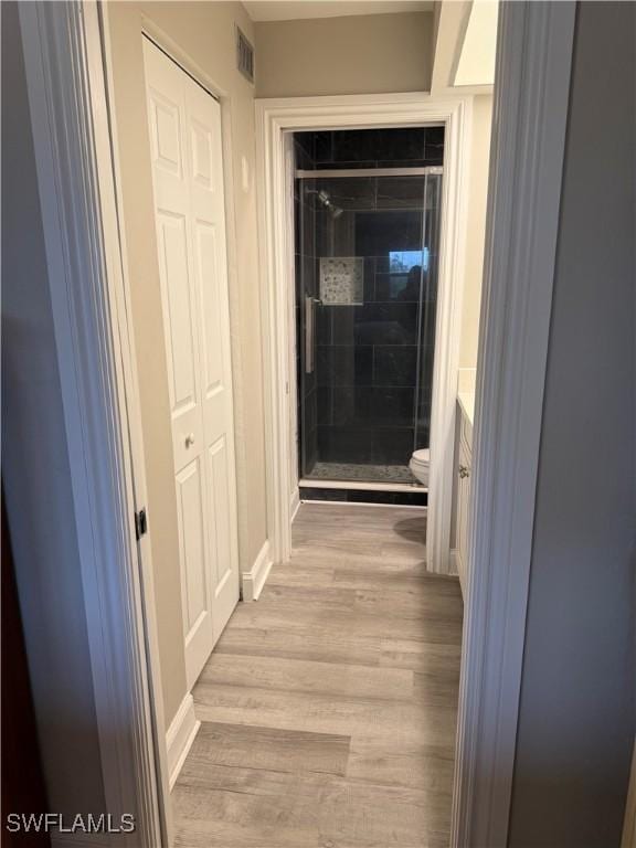 corridor featuring light hardwood / wood-style floors