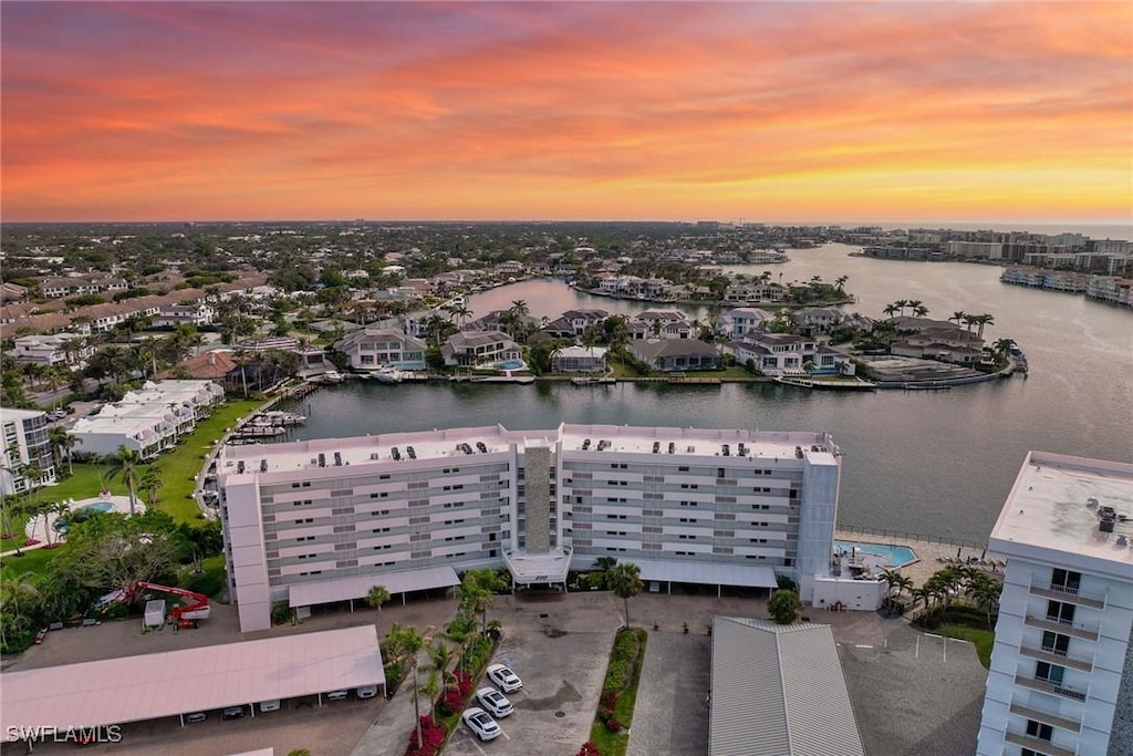 aerial view at dusk with a water view