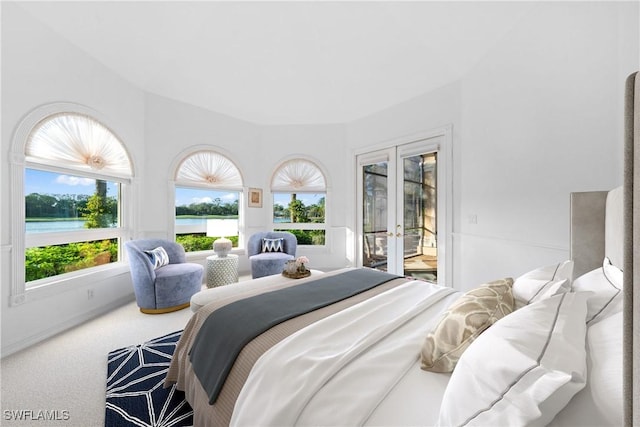 bedroom with access to outside, french doors, and carpet flooring